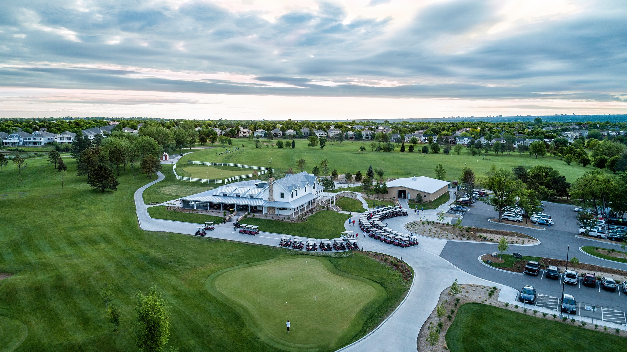 Aerial view of Raccoon Creek Golf Course with mountain backdrop